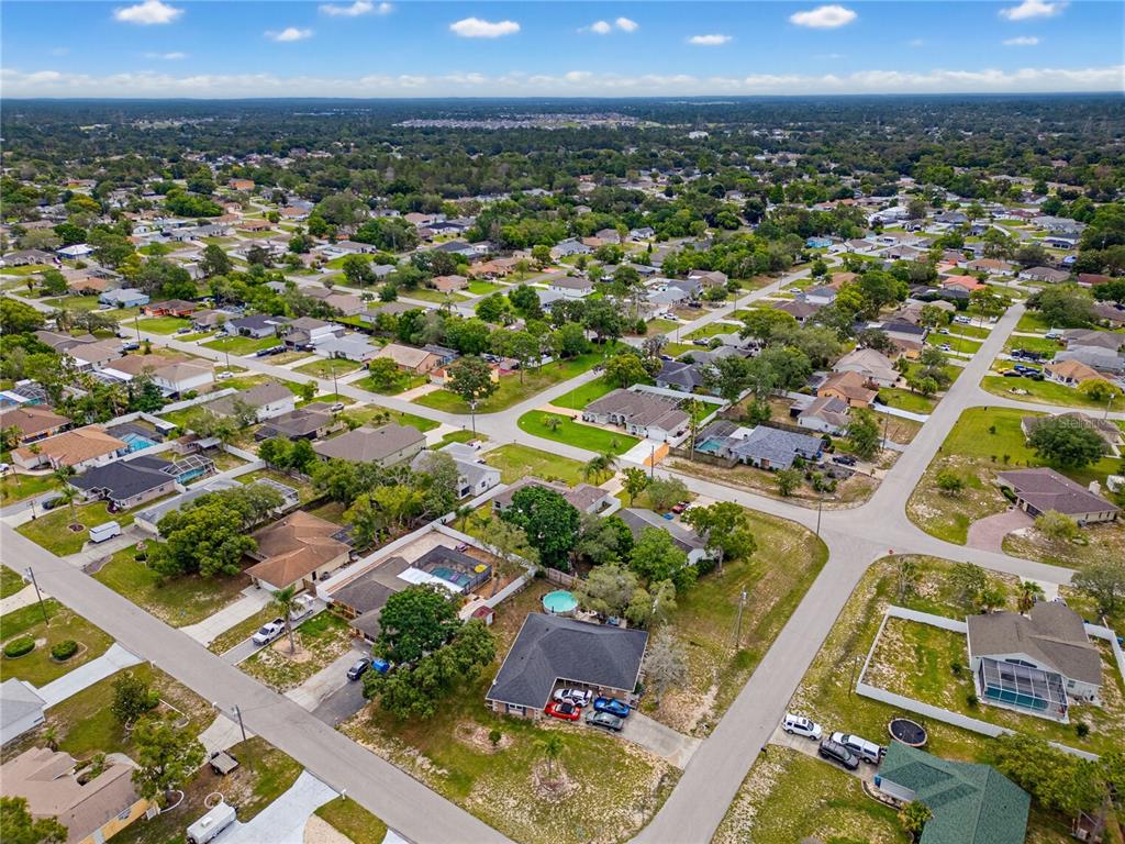 3497 Chadwick Avenue Spring Hill, FL 34609 - Photo 43 of 47 an aerial view of residential houses with outdoor space