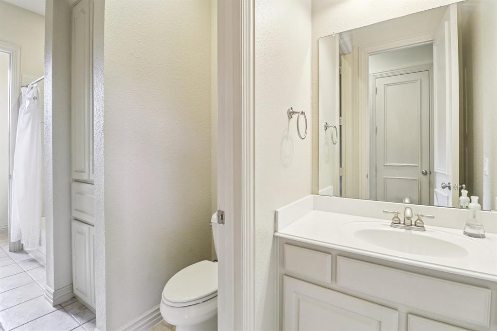 219 High Point Drive Murphy, TX 75094 - Photo 14 of 30 Clean and simple bathroom with a single sink vanity.