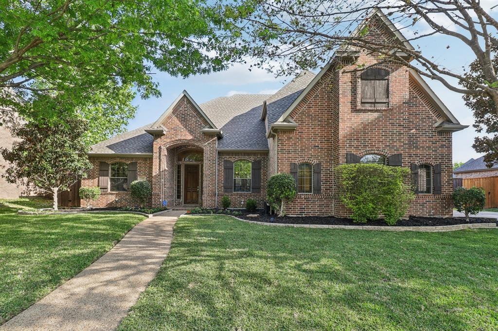 219 High Point Drive Murphy, TX 75094 - Photo 3 of 30 Beautiful brick front with a welcoming entry and well-kept yard.