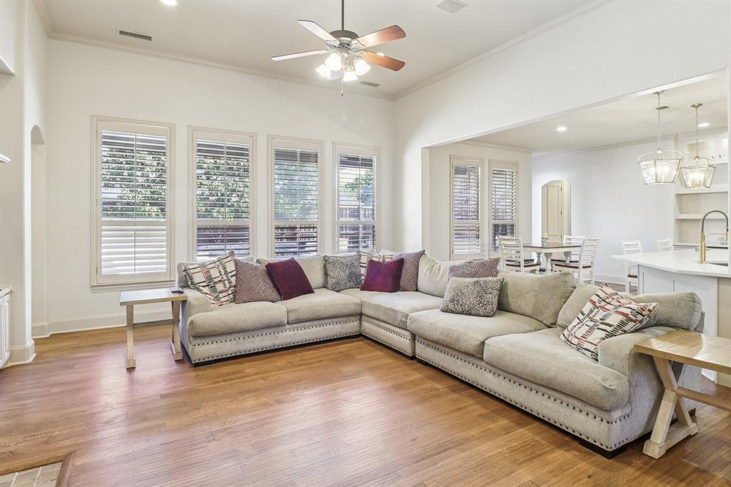 219 High Point Drive Murphy, TX 75094 - Photo 5 of 30 Bright living area with large windows, high ceilings, and an open layout.