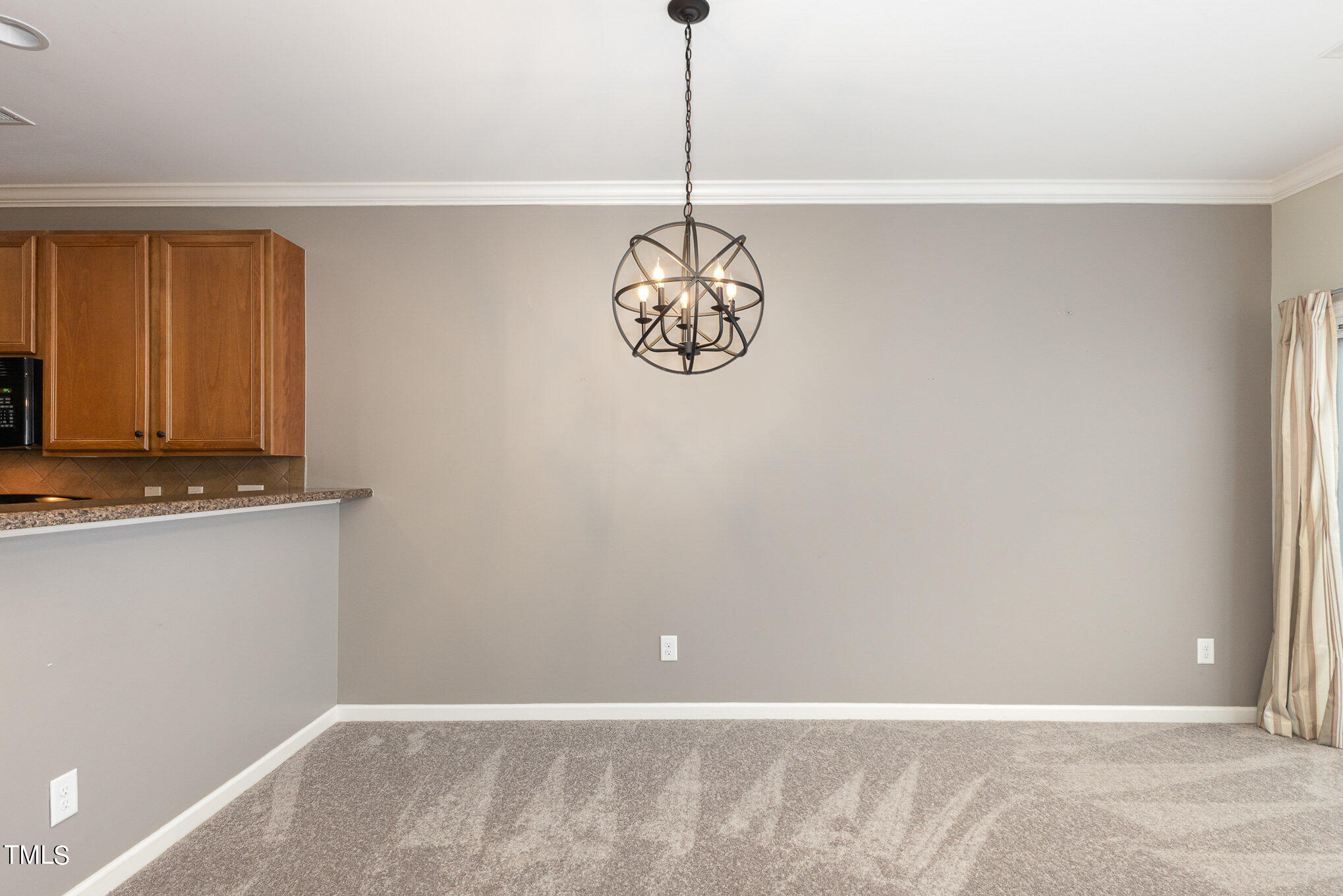 206 Leighann Ridge Lane Rolesville, NC 27571 - Photo 11 of 38 a view of a room with a chandelier fan
