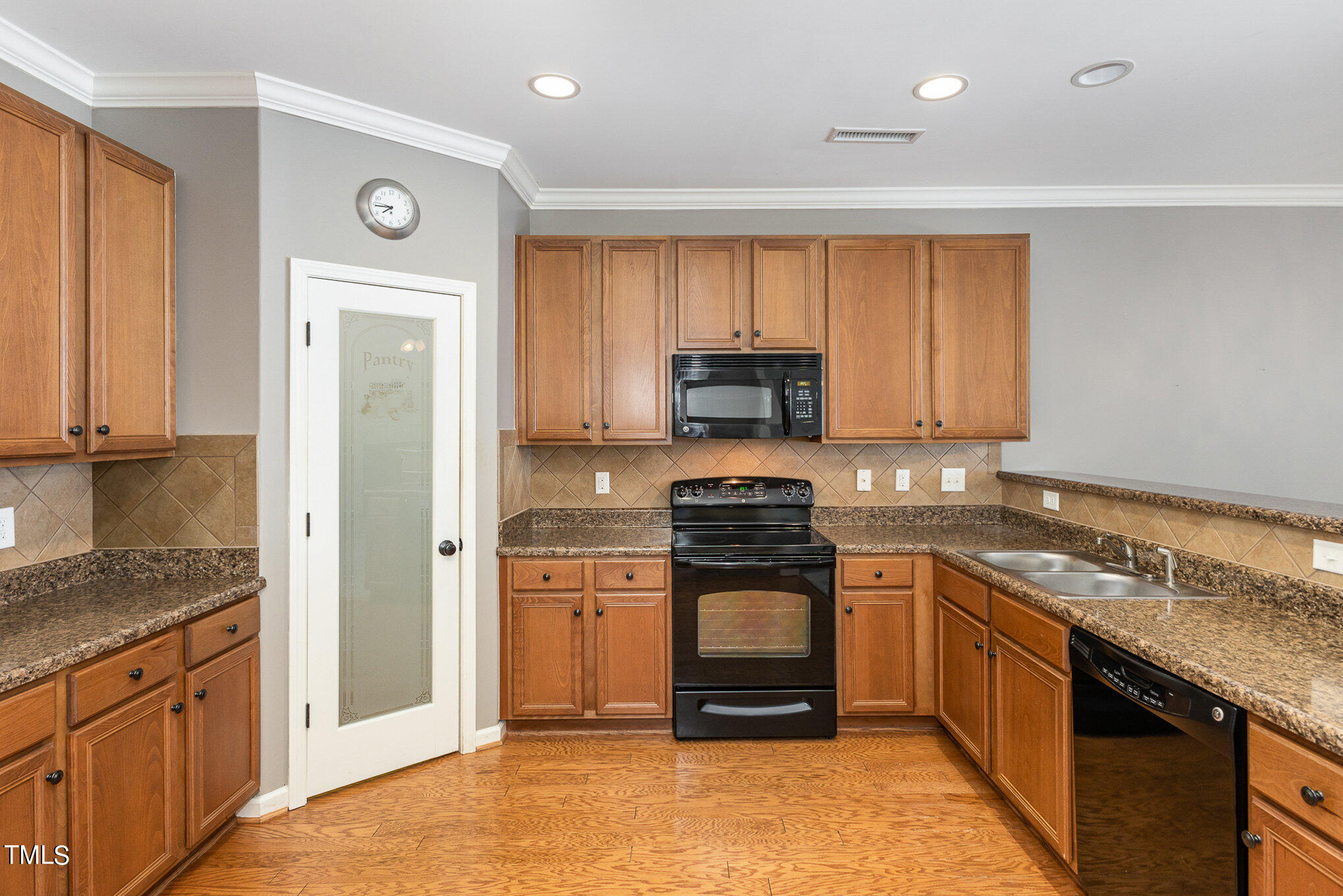 206 Leighann Ridge Lane Rolesville, NC 27571 - Photo 14 of 38 a kitchen with stainless steel appliances granite countertop a stove a sink and a refrigerator