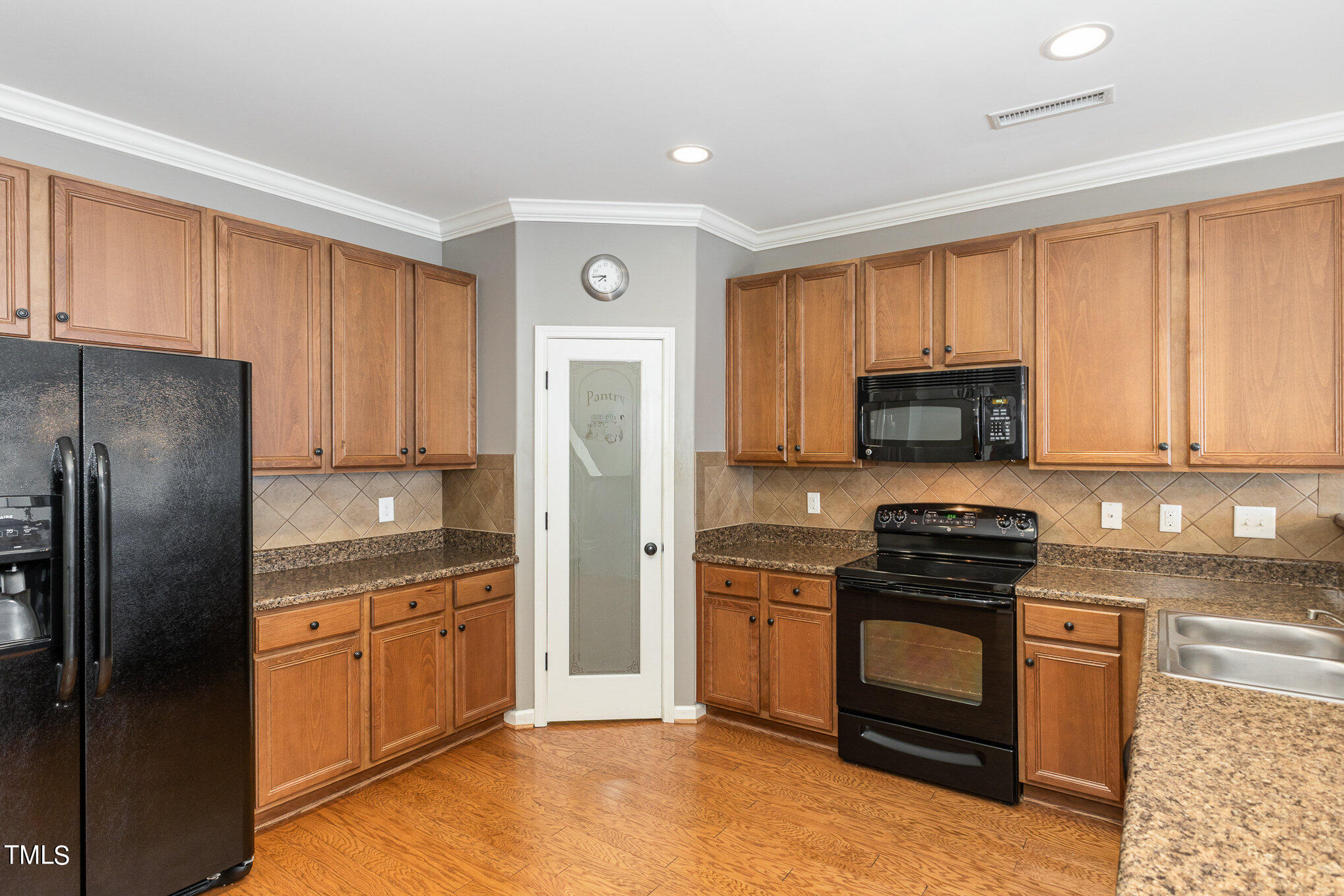 206 Leighann Ridge Lane Rolesville, NC 27571 - Photo 15 of 38 a kitchen with stainless steel appliances granite countertop a refrigerator stove and sink