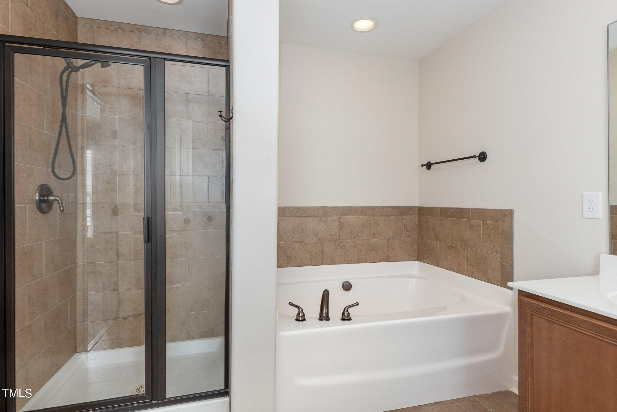 206 Leighann Ridge Lane Rolesville, NC 27571 - Photo 25 of 38 a bathroom with a bathtub and shower