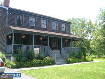 75 Gilbert Road Bordentown, NJ 08505 - Photo 1 of 12 a front view of a house with a yard and potted plants