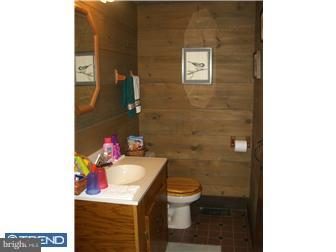 75 Gilbert Road Bordentown, NJ 08505 - Photo 12 of 12 a bathroom with a sink mirror and toilet