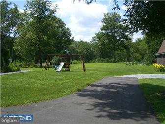 75 Gilbert Road Bordentown, NJ 08505 - Photo 3 of 12 a view of a park with large trees