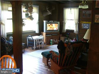 75 Gilbert Road Bordentown, NJ 08505 - Photo 5 of 12 a living room with furniture and a flat screen tv