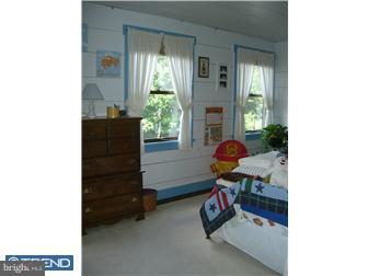 75 Gilbert Road Bordentown, NJ 08505 - Photo 10 of 12 a living room with furniture and a window