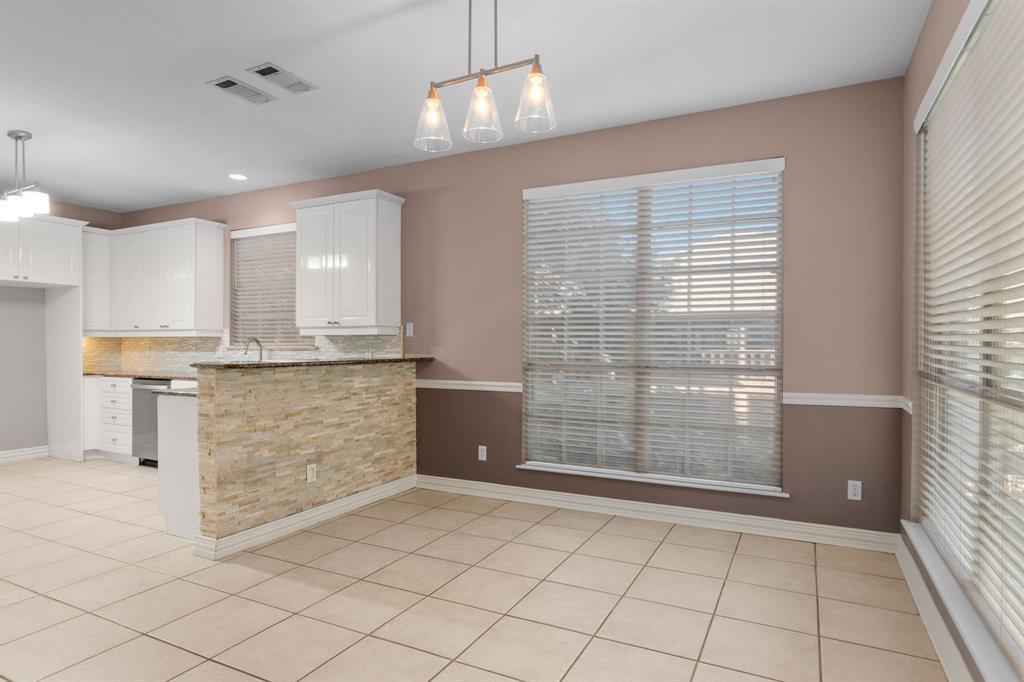 2 Shields Court Trophy Club, TX 76262 - Photo 14 of 39 a view of kitchen with granite countertop cabinets and window