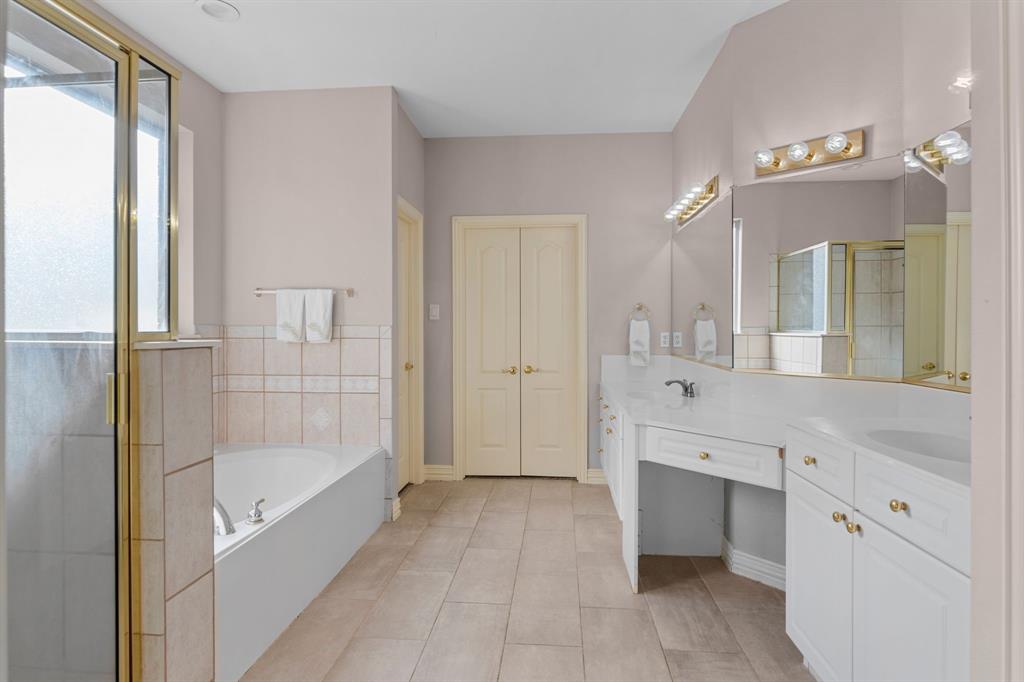 2 Shields Court Trophy Club, TX 76262 - Photo 22 of 39 a spacious bathroom with a tub shower and sink