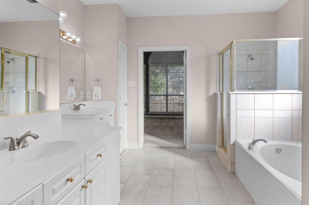 2 Shields Court Trophy Club, TX 76262 - Photo 23 of 39 a bathroom with a tub sink and mirror