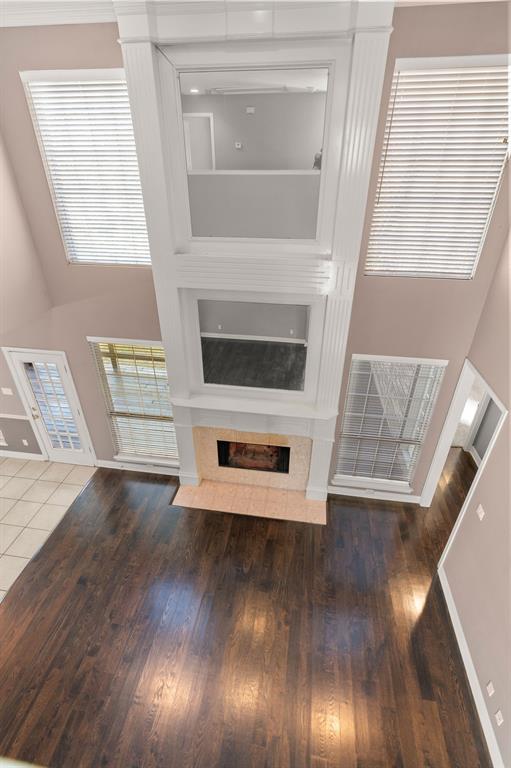2 Shields Court Trophy Club, TX 76262 - Photo 26 of 39 a view of a livingroom with wooden floor and staircase