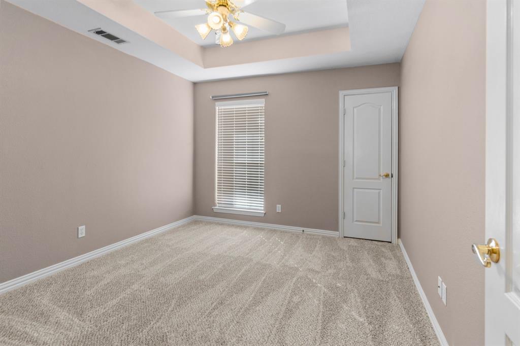 2 Shields Court Trophy Club, TX 76262 - Photo 32 of 39 a view of an empty room with a chandelier fan
