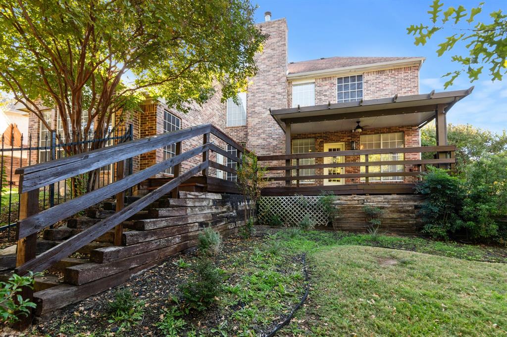 2 Shields Court Trophy Club, TX 76262 - Photo 37 of 39 a view of a house with a yard