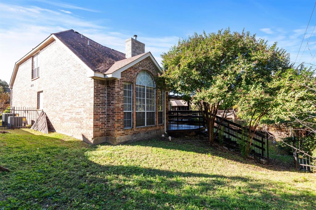 2 Shields Court Trophy Club, TX 76262 - Photo 39 of 39 a view of backyard with a garden and deck