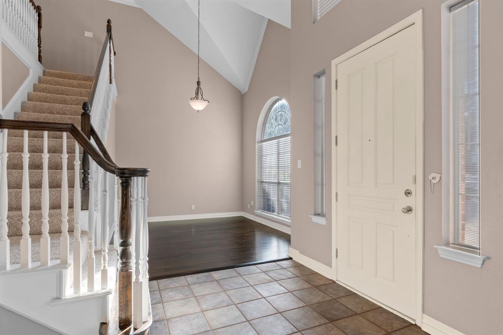 2 Shields Court Trophy Club, TX 76262 - Photo 5 of 39 a view of an entryway with wooden floor and door