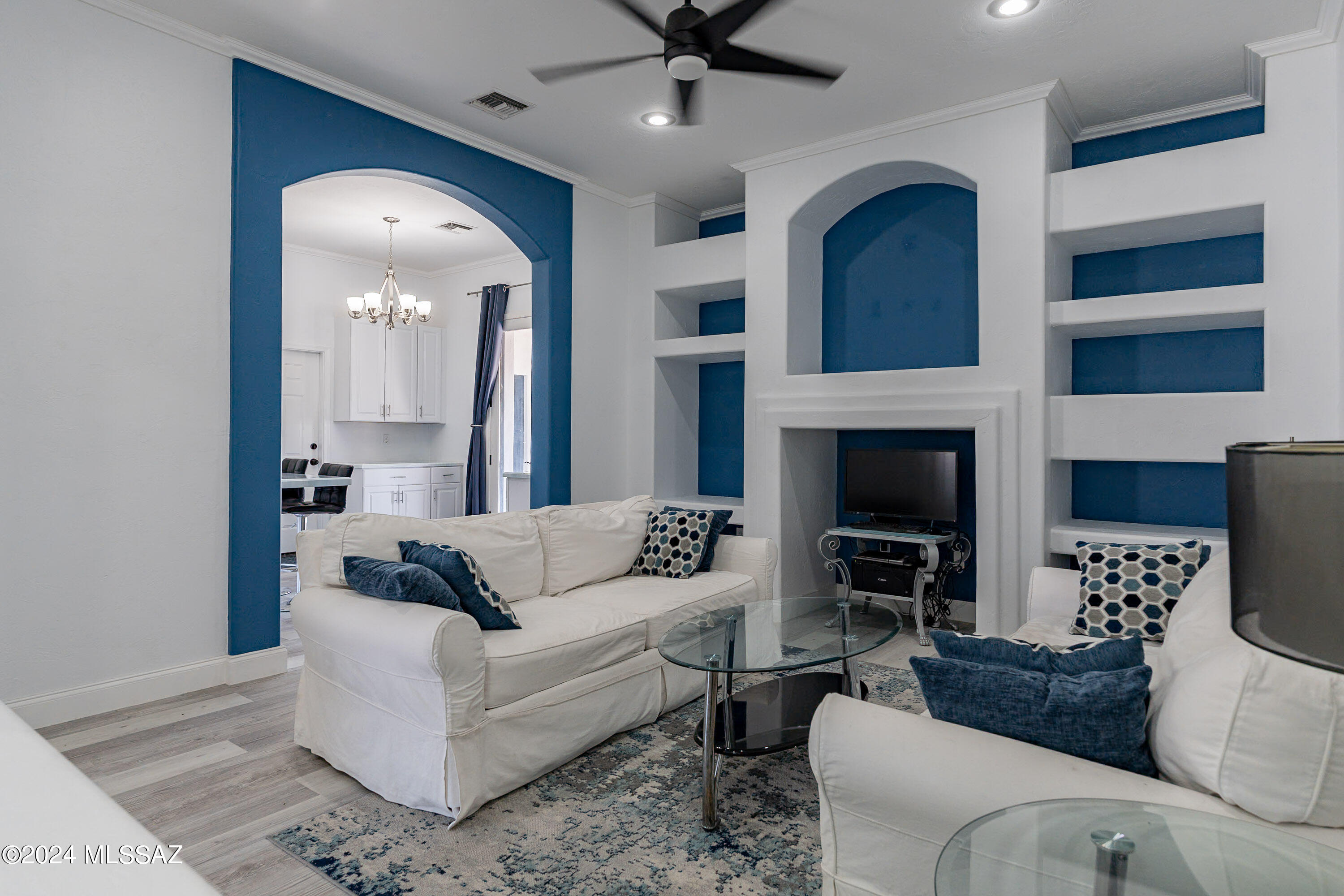 1009 Calle Coyote Rio Rico, AZ 85648 - Photo 4 of 28 a living room with furniture and a fireplace