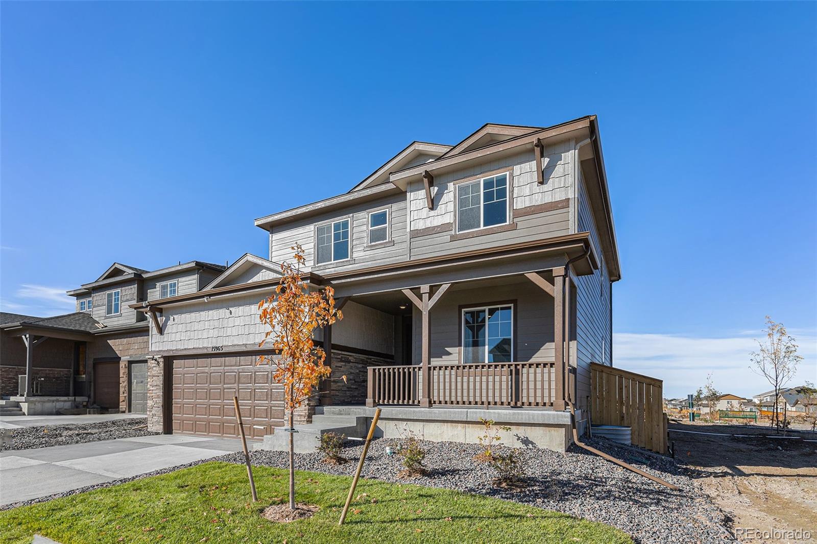15965 Stringhalt Way Parker, CO 80134 - Photo 2 of 33 a front view of a house with garden