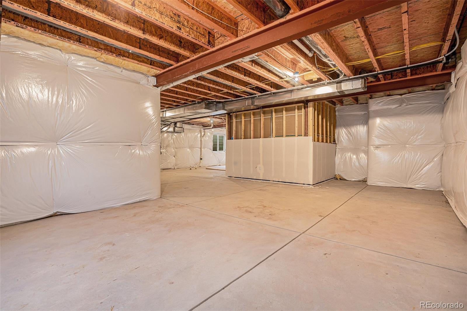 15965 Stringhalt Way Parker, CO 80134 - Photo 26 of 33 a view of a room with racks on the wall