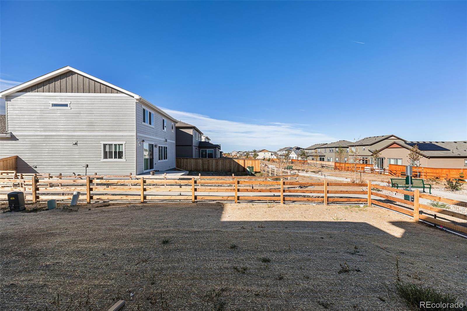 15965 Stringhalt Way Parker, CO 80134 - Photo 29 of 33 a view of a house with a yard