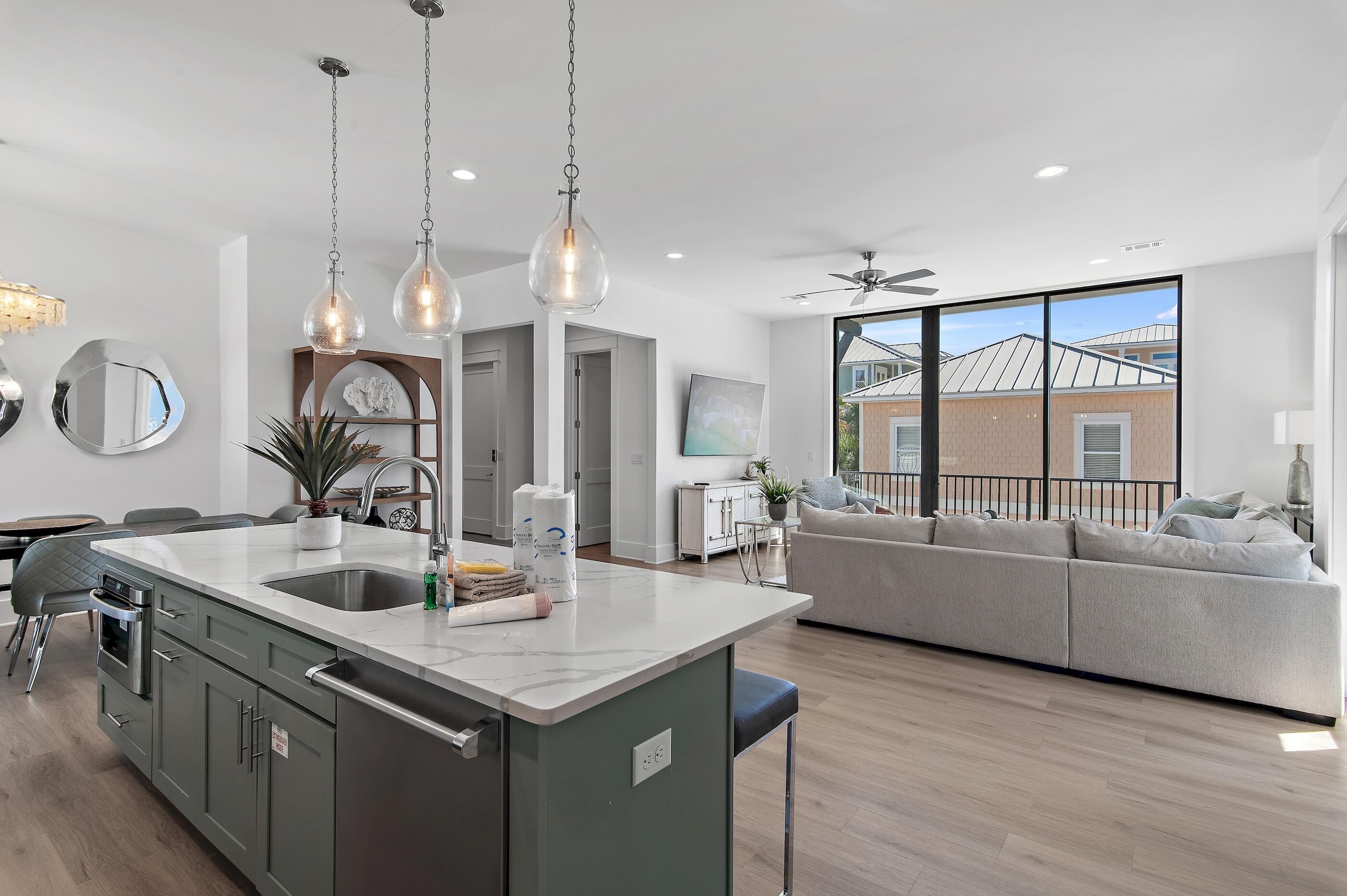 217 Snowdrift Road Miramar Beach, FL 32550 - Photo 17 of 66 a kitchen with a sink a counter top space and living room view