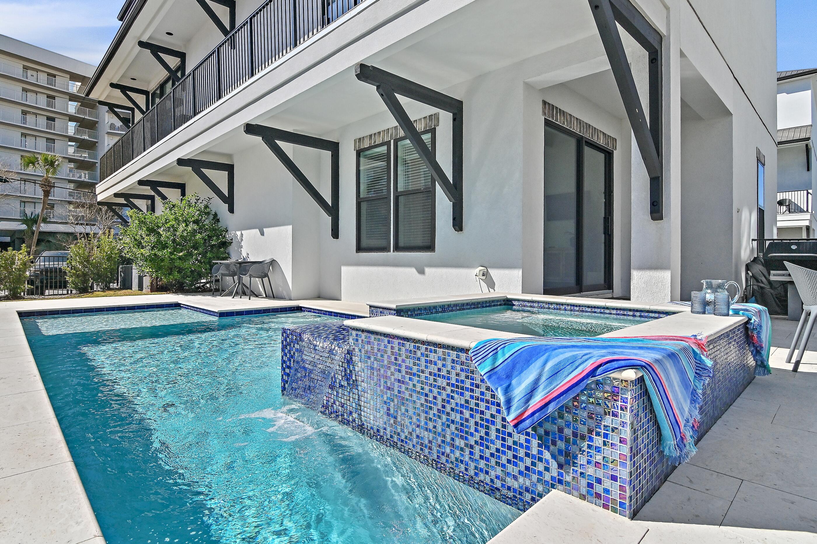 217 Snowdrift Road Miramar Beach, FL 32550 - Photo 24 of 66 a swimming pool with outdoor seating and yard