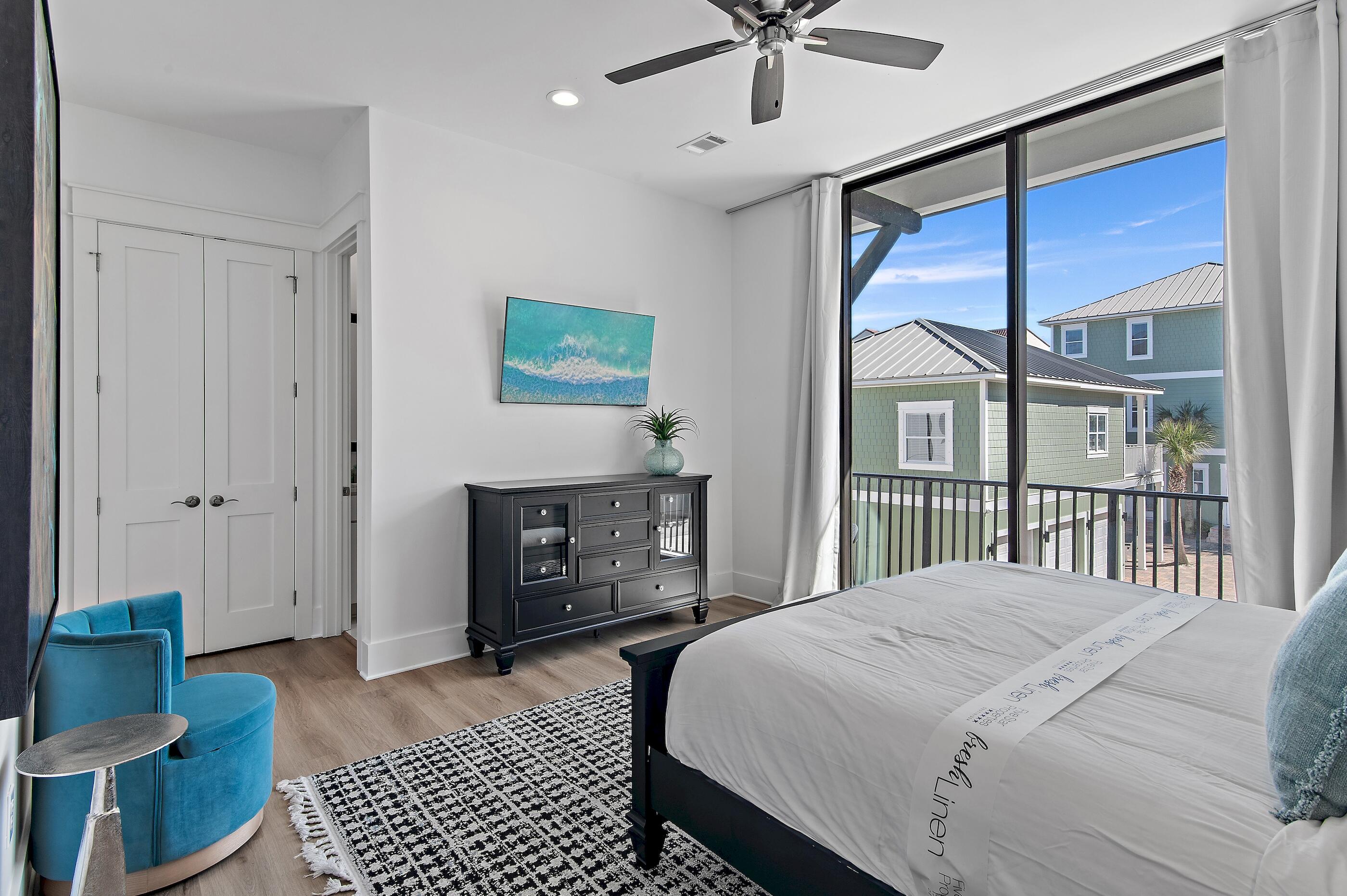 217 Snowdrift Road Miramar Beach, FL 32550 - Photo 31 of 66 a bedroom with a balcony a bed and a table