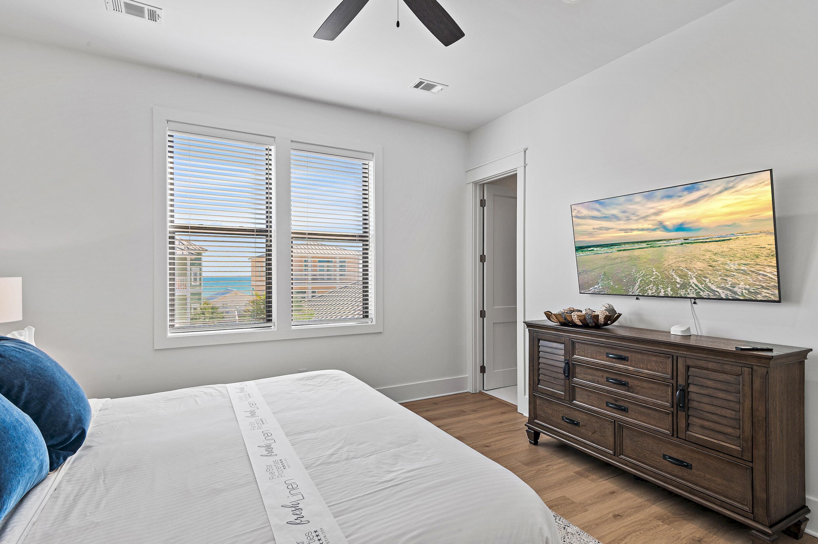 217 Snowdrift Road Miramar Beach, FL 32550 - Photo 38 of 66 a bedroom with a bed and a flat screen tv