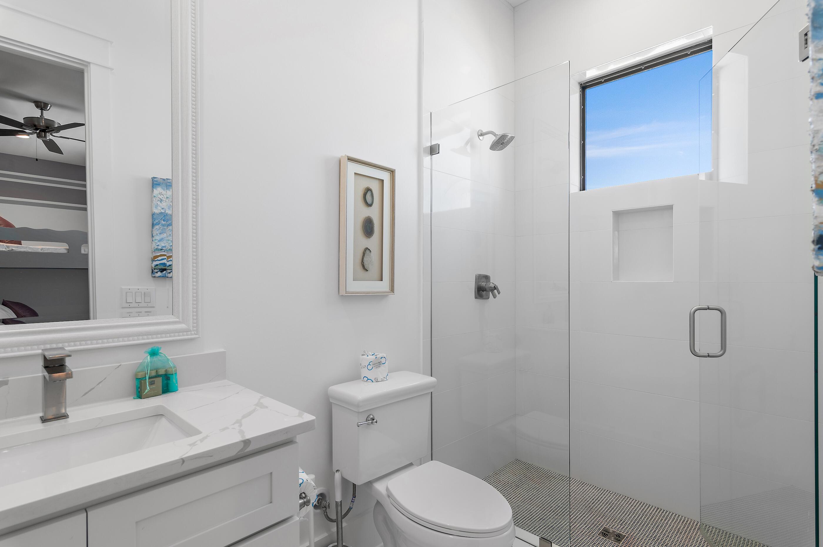 217 Snowdrift Road Miramar Beach, FL 32550 - Photo 43 of 66 a bathroom with a sink a toilet and shower