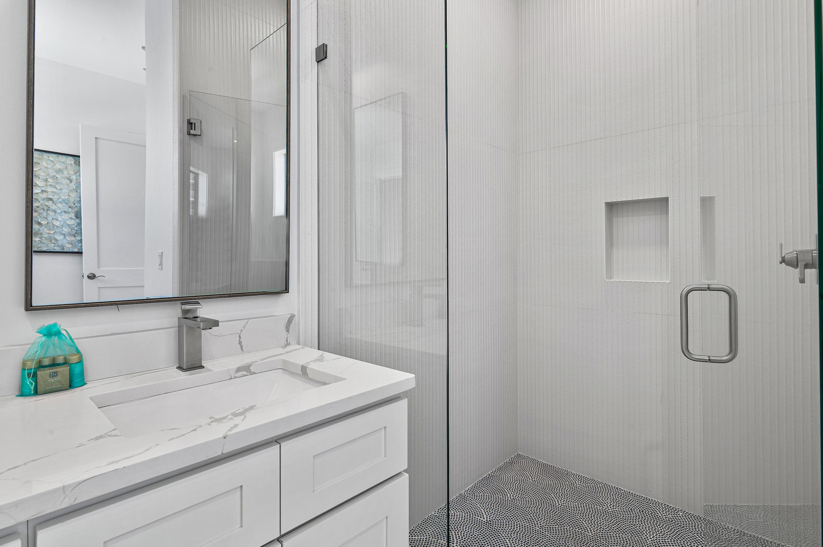 217 Snowdrift Road Miramar Beach, FL 32550 - Photo 50 of 66 a bathroom with a granite countertop sink and a mirror