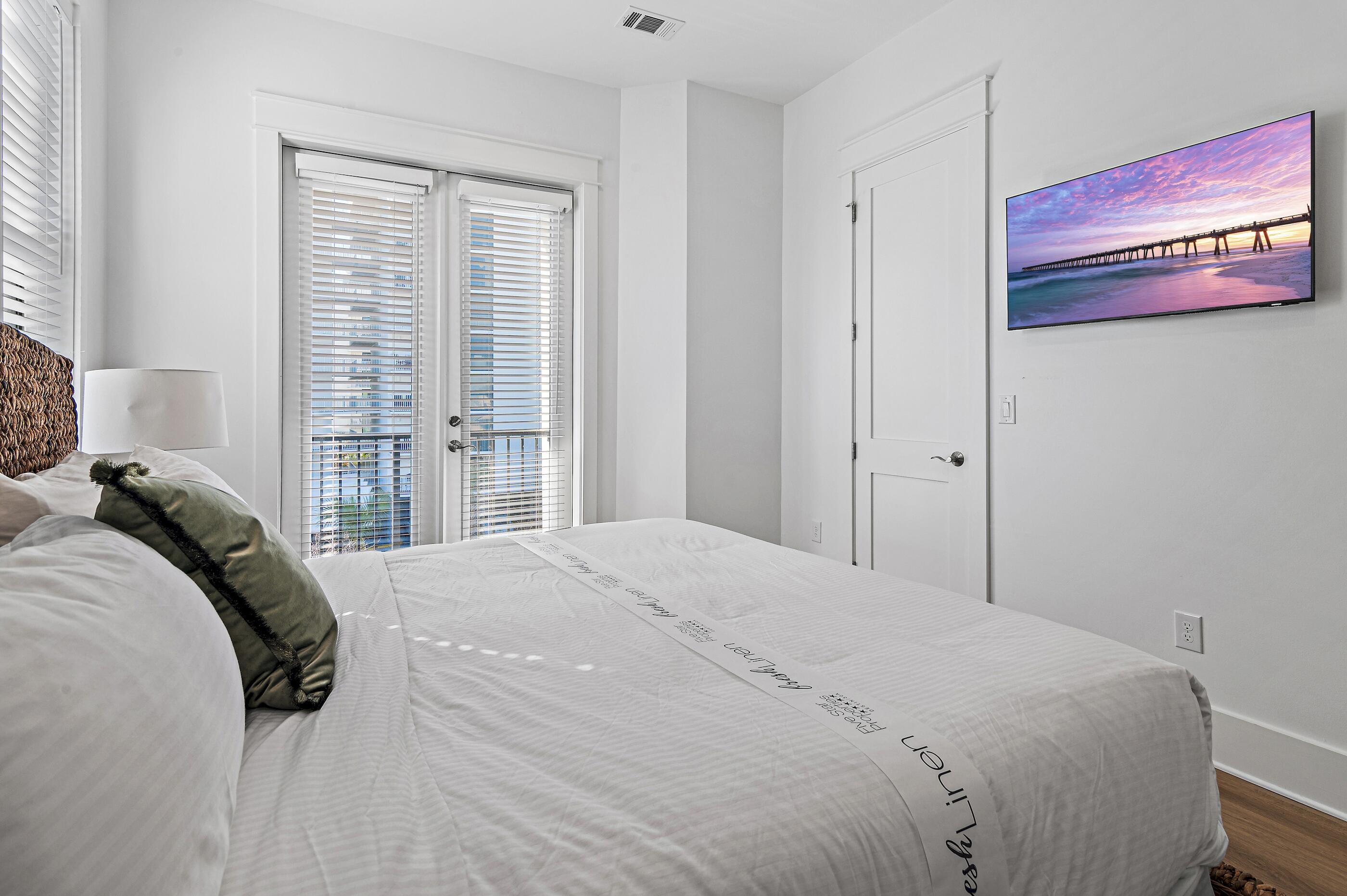 217 Snowdrift Road Miramar Beach, FL 32550 - Photo 52 of 66 a spacious bedroom with a bed and a window