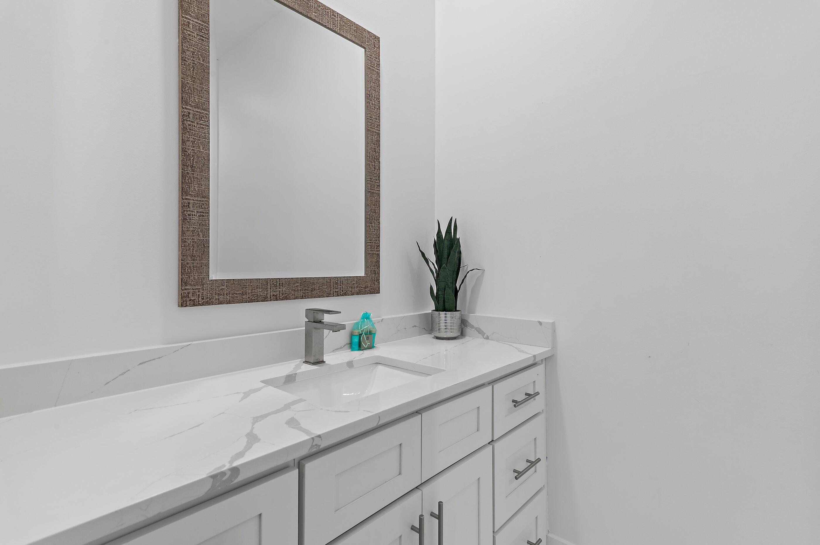 217 Snowdrift Road Miramar Beach, FL 32550 - Photo 60 of 66 a bathroom with a sink and a mirror