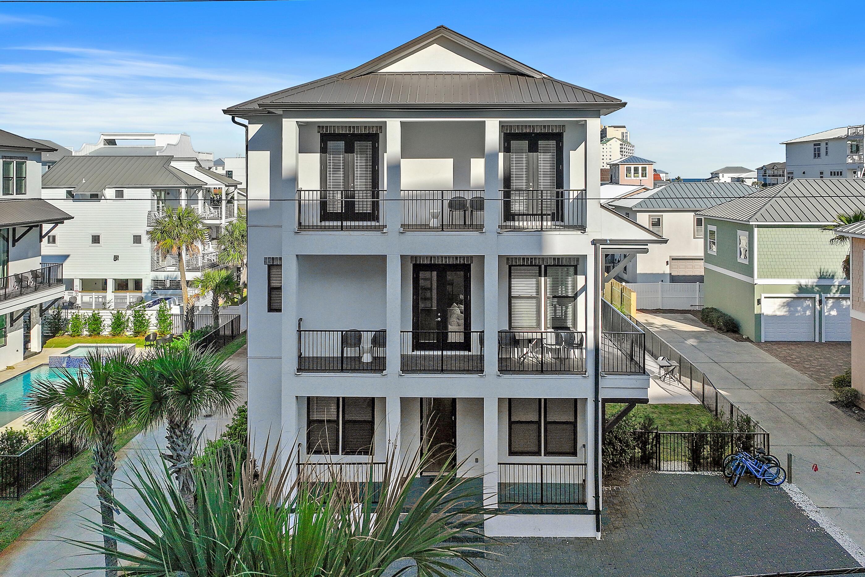 217 Snowdrift Road Miramar Beach, FL 32550 - Photo 7 of 66 a front view of a residential apartment building with a yard