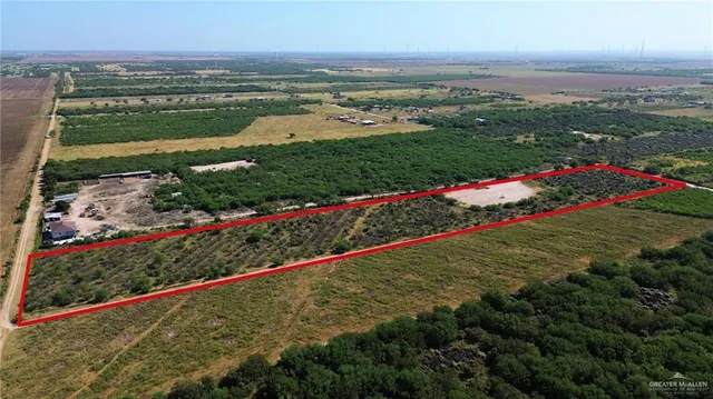 an aerial view of house with yard space and lake view