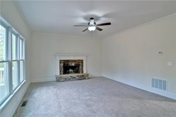 a kitchen with stainless steel appliances granite countertop a sink refrigerator and microwave