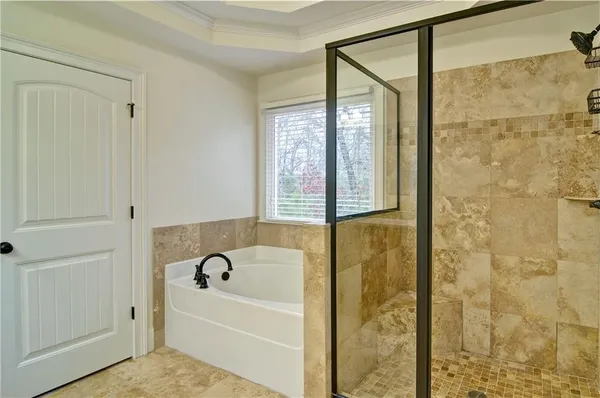 a bathroom with a granite countertop sink toilet a mirror and shower