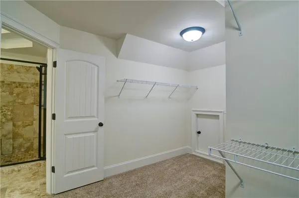 a kitchen with granite countertop a sink and cabinets