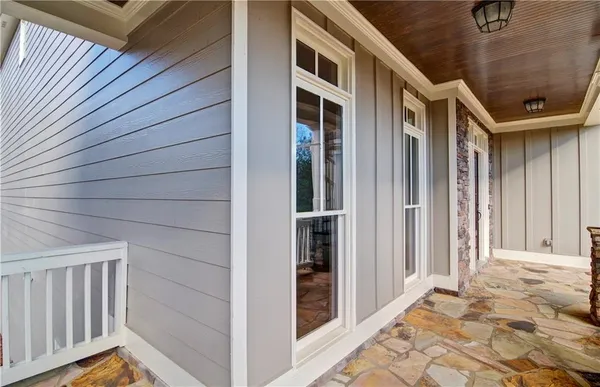 a view of an entryway with wooden floor and door