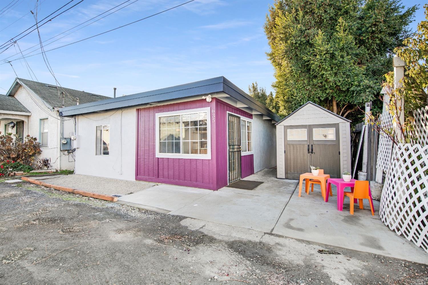 635 Rodeo Avenue Rodeo, CA 94572 - Photo 1 of 1 a front view of a house with a garage