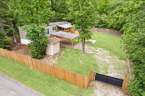 a view of yard from deck having patio