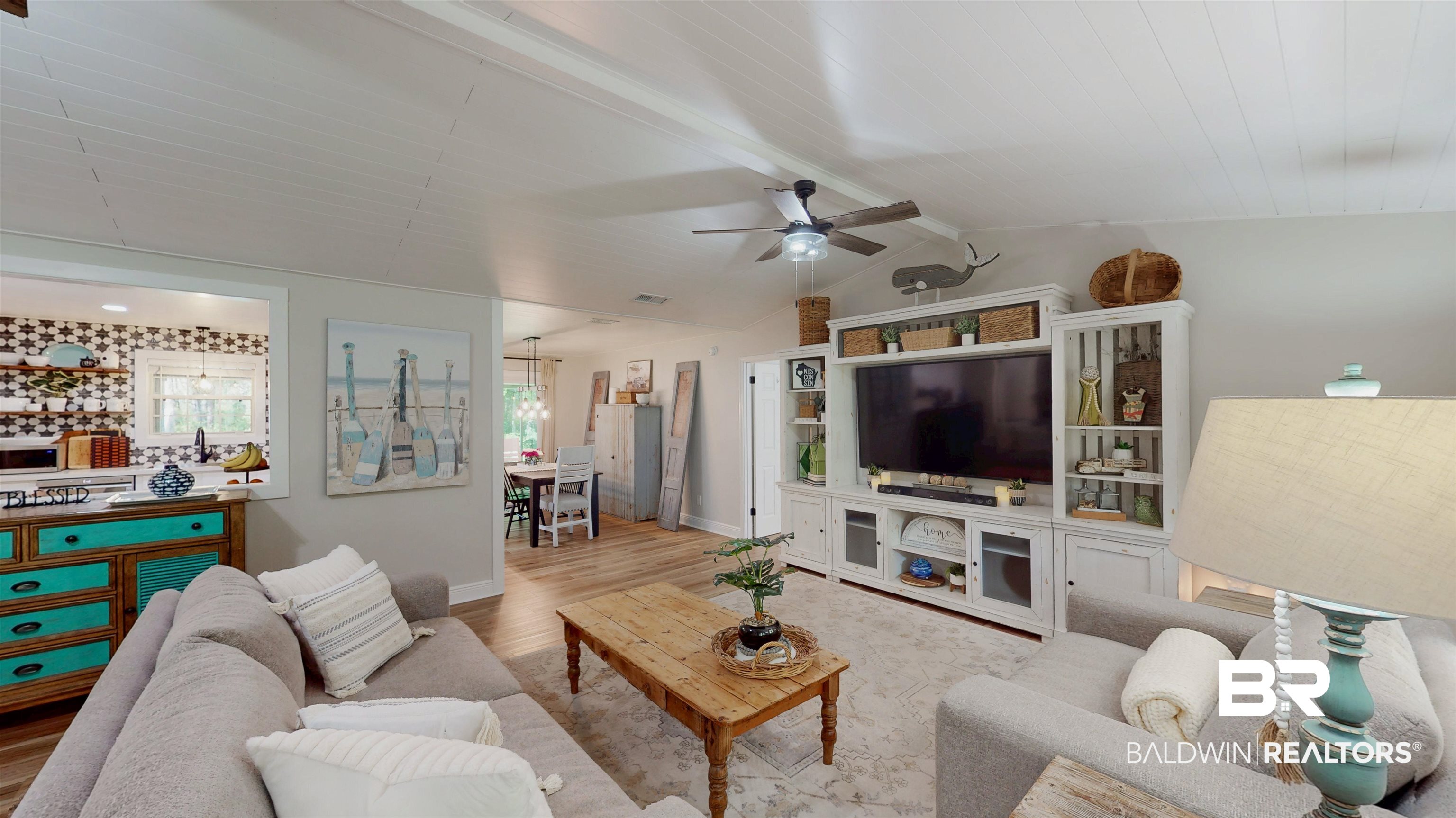9902 Clarke Ridge Road Foley, AL 36535 - Photo 9 of 61 Living area featuring lofted ceiling with beams, baseboards, a ceiling fan, and wood finished floors