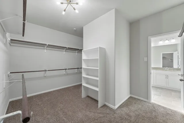 a view of an empty walk in closet