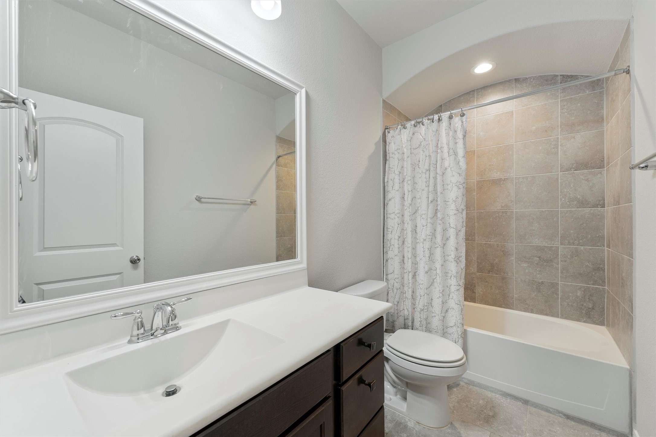 12043 Talmadge Reach Drive Humble, TX 77346 - Photo 20 of 33 a bathroom with a sink toilet and shower