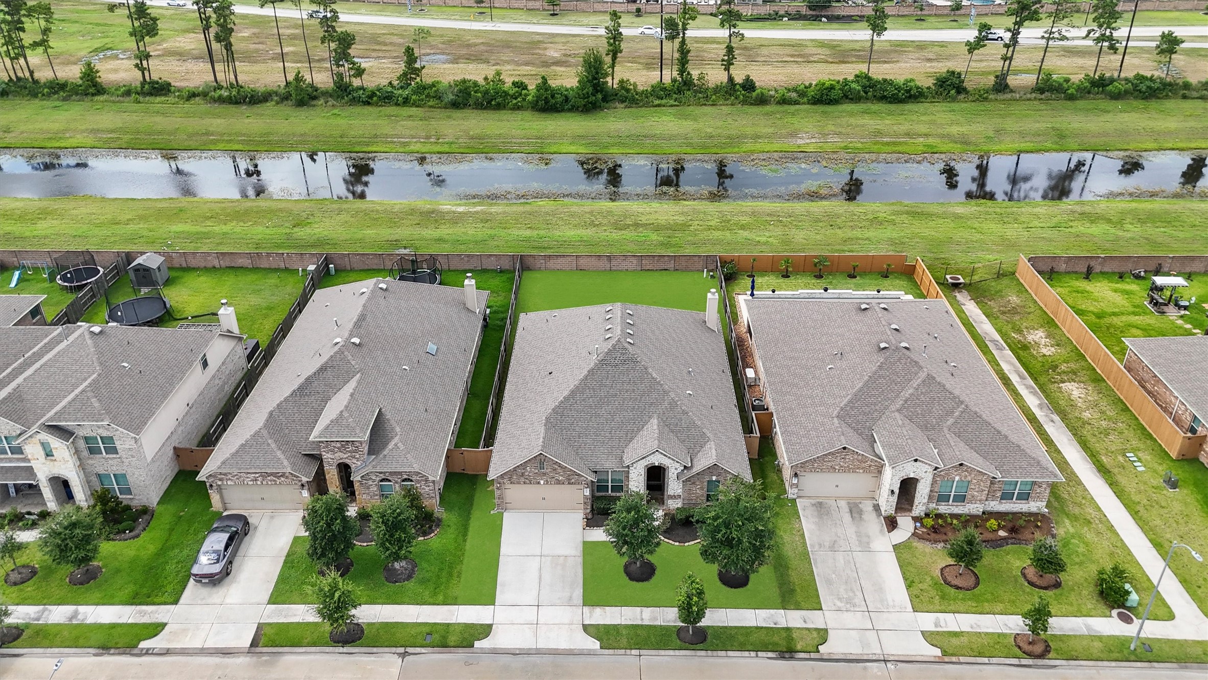 12043 Talmadge Reach Drive Humble, TX 77346 - Photo 26 of 33 an aerial view of a house with a garden