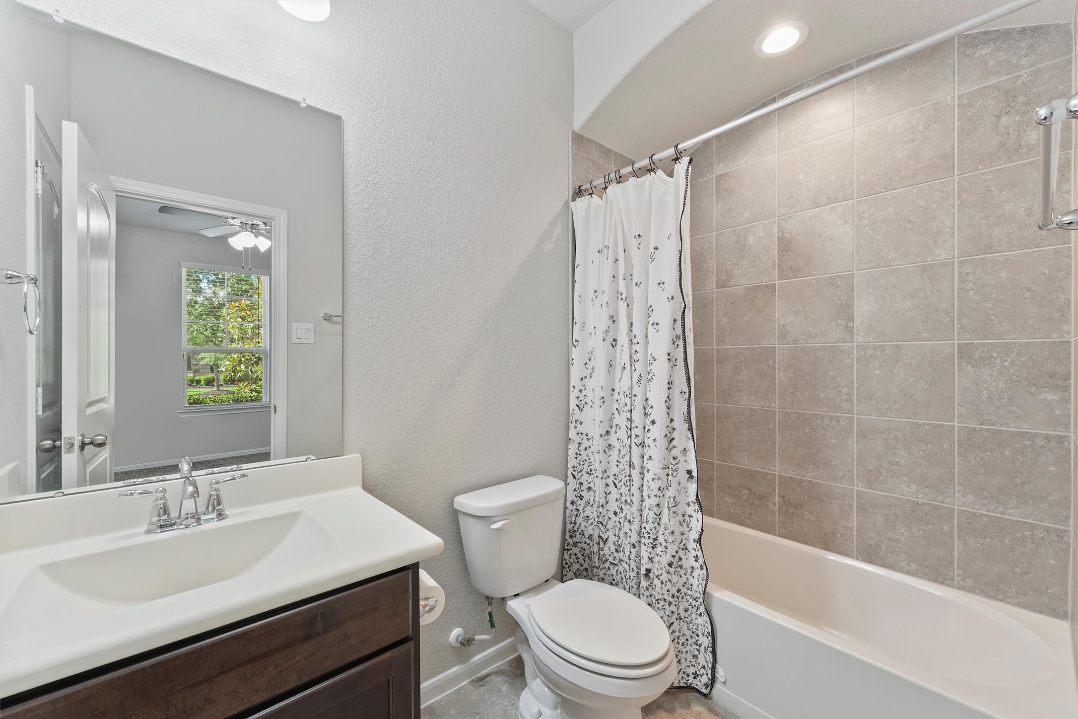 12043 Talmadge Reach Drive Humble, TX 77346 - Photo 6 of 33 a bathroom with a sink a toilet and shower