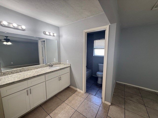 2410 Autumn Springs Lane Spring, TX 77373 - Photo 6 of 12 a spacious bathroom with a granite countertop sink and a mirror