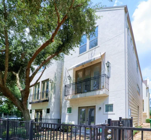 a front view of a residential apartment building with a yard
