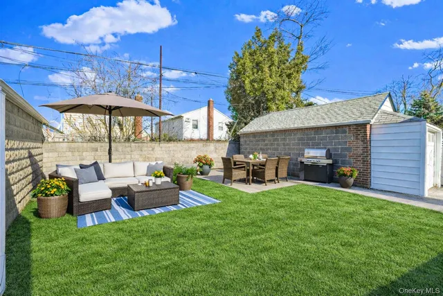 a view of a house with backyard porch and sitting area