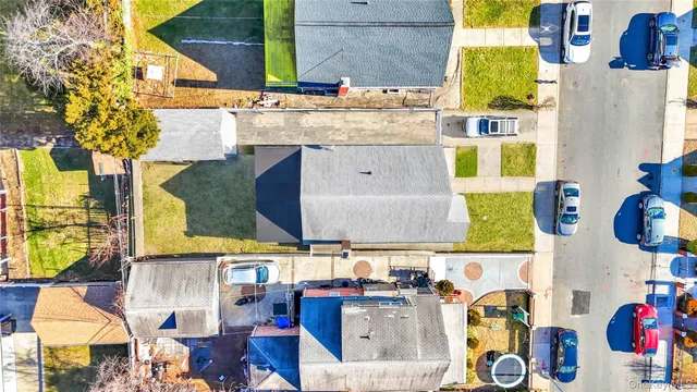 an aerial view of residential houses and outdoor space